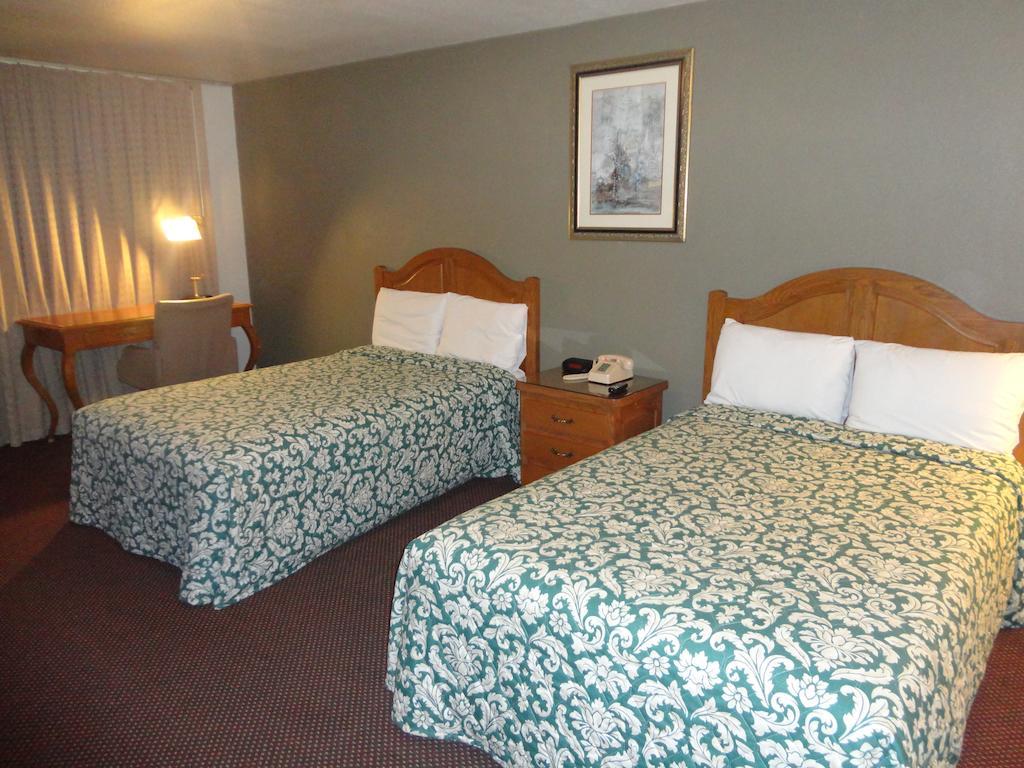 Garden Inn And Suites Silsbee Rum bild